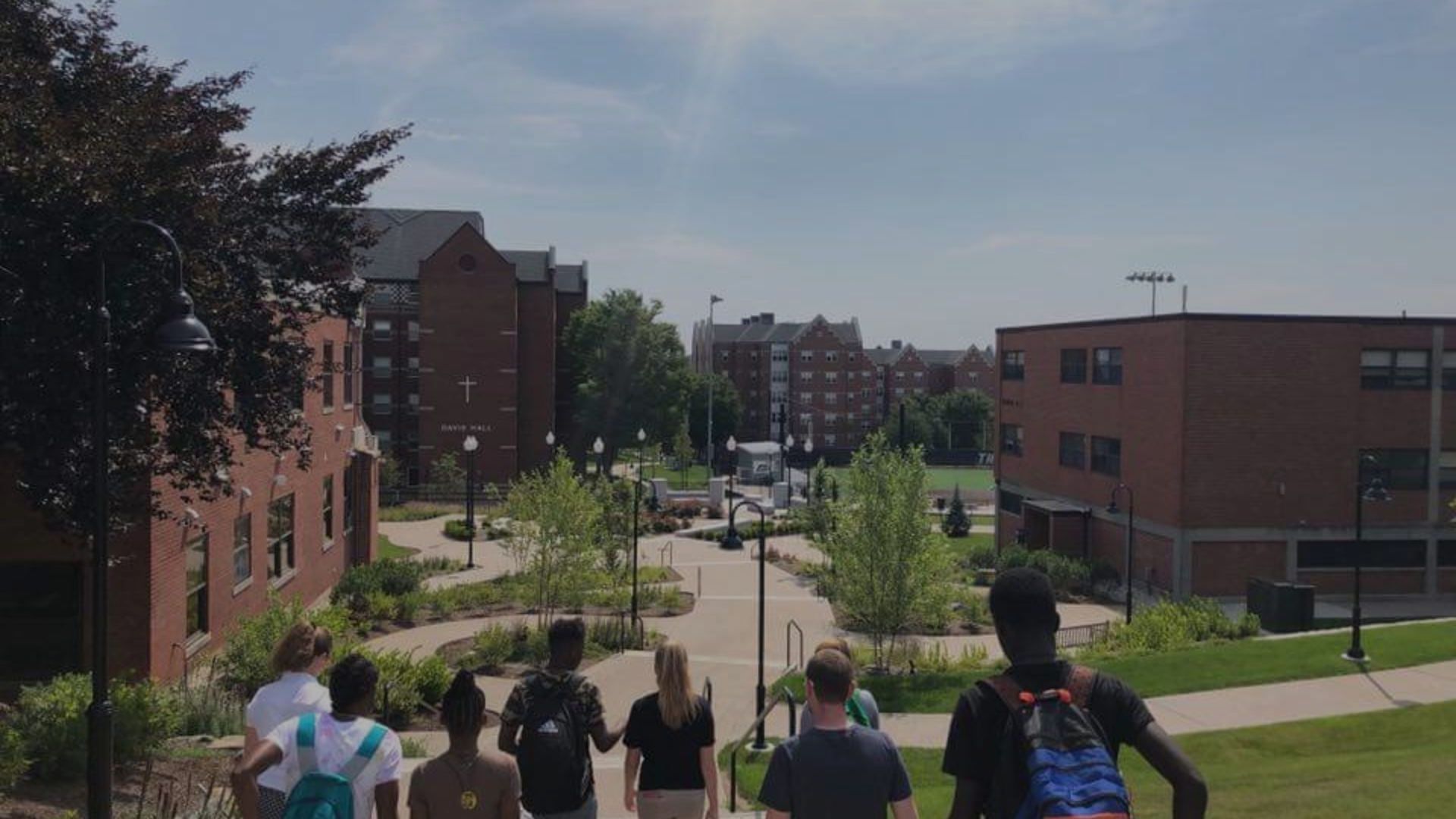 Group of students on a college tour with black overlay